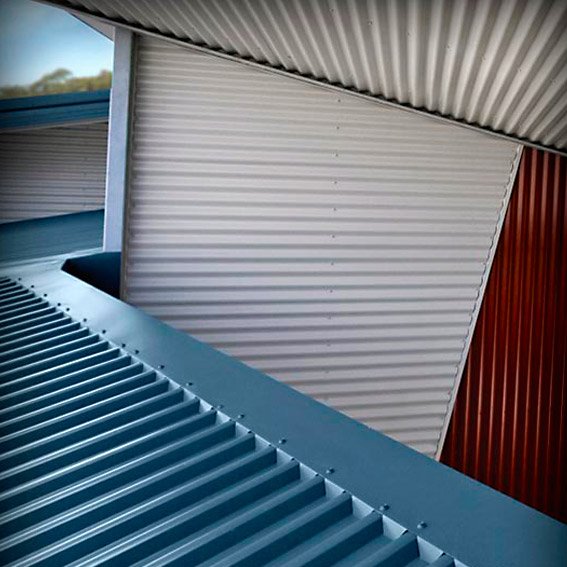 corrugated roof and walls in blue red and white